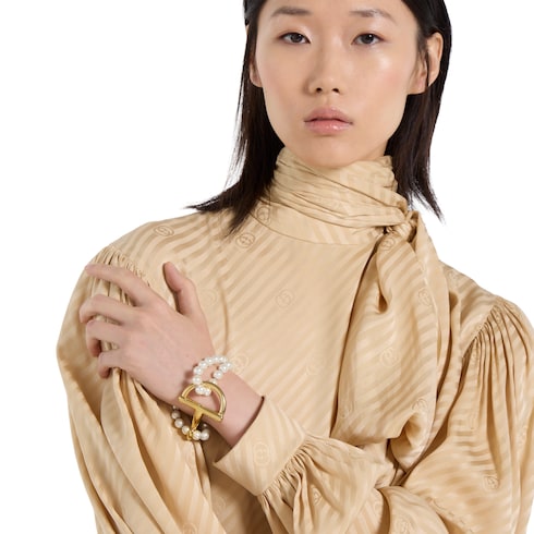 Bracelet with stirrup - gold-toned brass