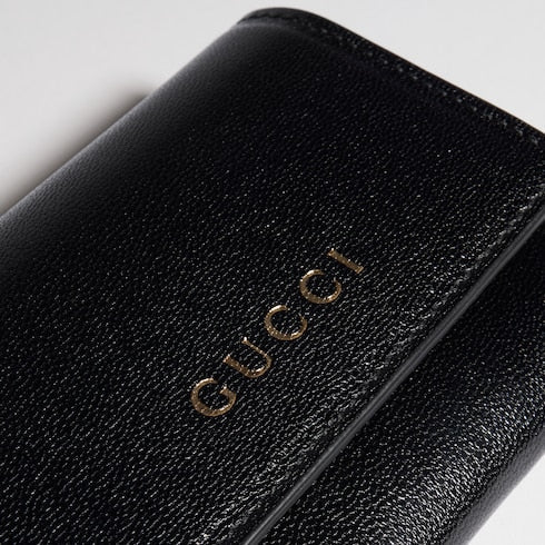 Bi-fold card case with Gucci lettering - black leather