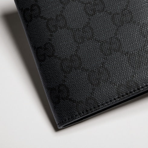 Gucci Essence Classic passport case - black GG canvas