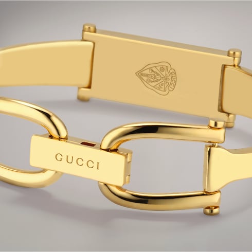 Stirrup motif bangle bracelet - gold-toned brass